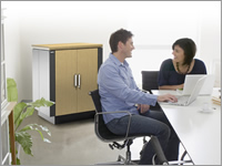 APC Netshelter CX quiet rack cabinets shown in office situation.